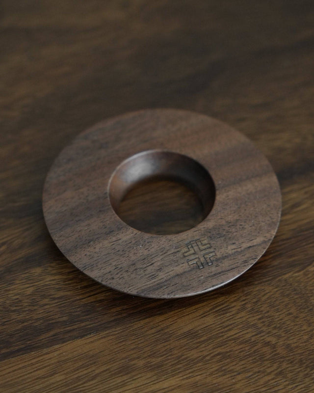 Ninety Plus Coffee Kone Ring 10.1 in walnut wood, circular base for mini pour-over coffee dripper, featuring sleek design with engraved logo, positioned on wooden surface