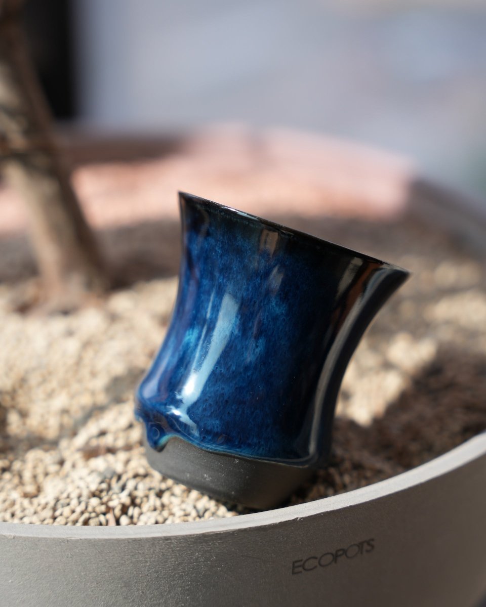 Close-up of the opening and body, showing the flow and depth of the glaze
